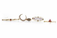 Lot 114 - FOUR EARLY TWENTIETH CENTURY BROOCHES...