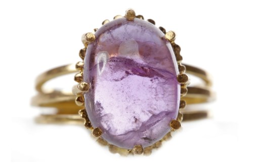 Lot 183 - 1960S AMETHYST DRESS RING set with a single...