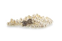 Lot 210 - TWO STRANDED PEARL NECKLACE formed by two rows...