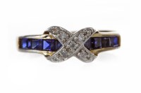 Lot 216 - GEM SET DRESS RING formed by a band with a row...