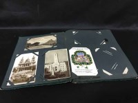 Lot 146 - TWO ALBUMS OF POSTCARDS and a quantity of...