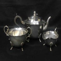 Lot 148 - SILVER PLATED OVAL TEA TRAY and a three piece...