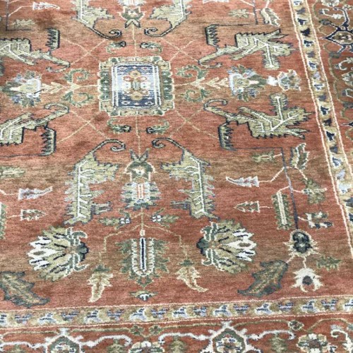 Lot 194 - TWO RUGS on a pink ground