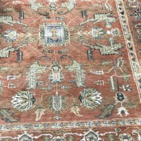 Lot 194 - TWO RUGS on a pink ground