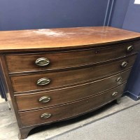 Lot 449 - REGENCY MAHOGANY BOWFRONT CHEST on four long...