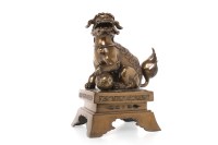 Lot 1046 - CHINESE BRONZE FOE DOG on a rectangular plinth...