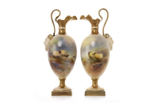 Lot 1223 - PAIR OF ROYAL WORCESTER EWERS both of footed...