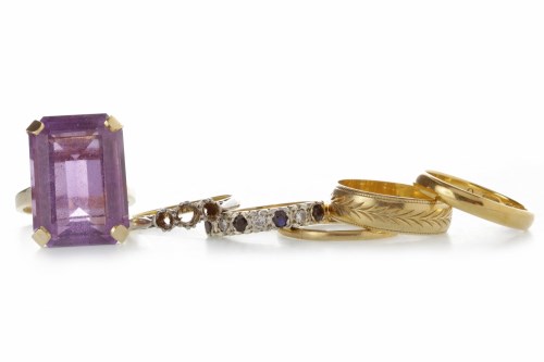 Lot 501 - LARGE AMETHYST DRESS RING set with a single...