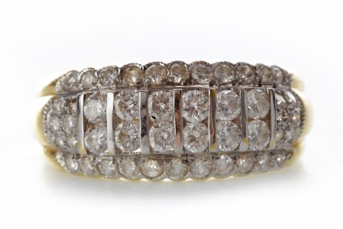 Lot 526 - DIAMOND DRESS RING with two central rows of...