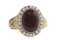 Lot 633 - VICTORIAN GARNET AND SEED PEARL RING set with...
