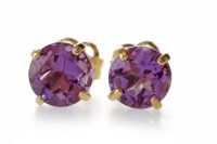 Lot 665 - PAIR OF AMETHYST EARRINGS each with a claw set...