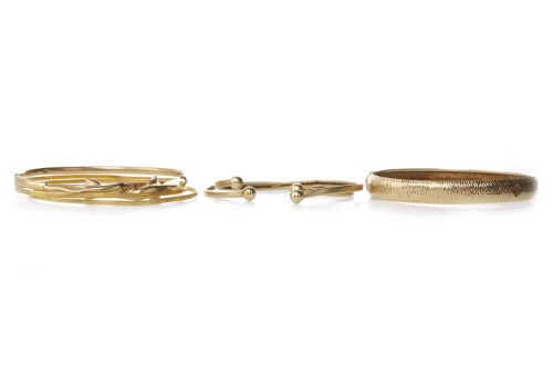 Lot 666 - NINE CARAT GOLD DOLPHIN MOTIF BANGLE along...