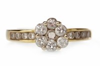 Lot 728 - DIAMOND CLUSTER RING the round bezel set with...