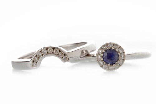 Lot 752 - SAPPHIRE AND DIAMOND CLUSTER RING set with a...
