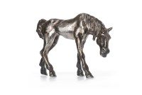 Lot 1747 - SILVERED SCULPTURE OF A FOAL modelled leaning...