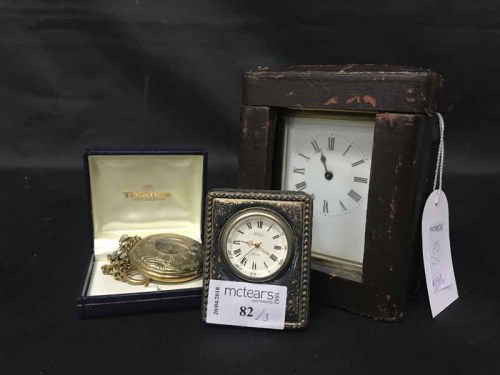 Lot 82 - CARRIAGE CLOCK contained within a leather...