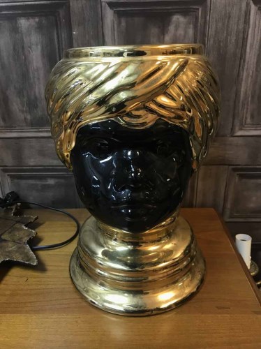 Lot 152 - BLACK AND GOLD CERAMIC FIGURE of a boys head,...