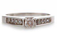 Lot 544 - DIAMOND SOLITAIRE RING with a four claw set...