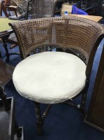 Lot 388 - CANE PANELLED ARMCHAIR with rounded back,...